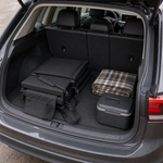 Two Full Game Chairs folded flat side by side in the back of a car